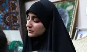 تصویری از زینب سلیمانی در مراسم تشییع شهدا